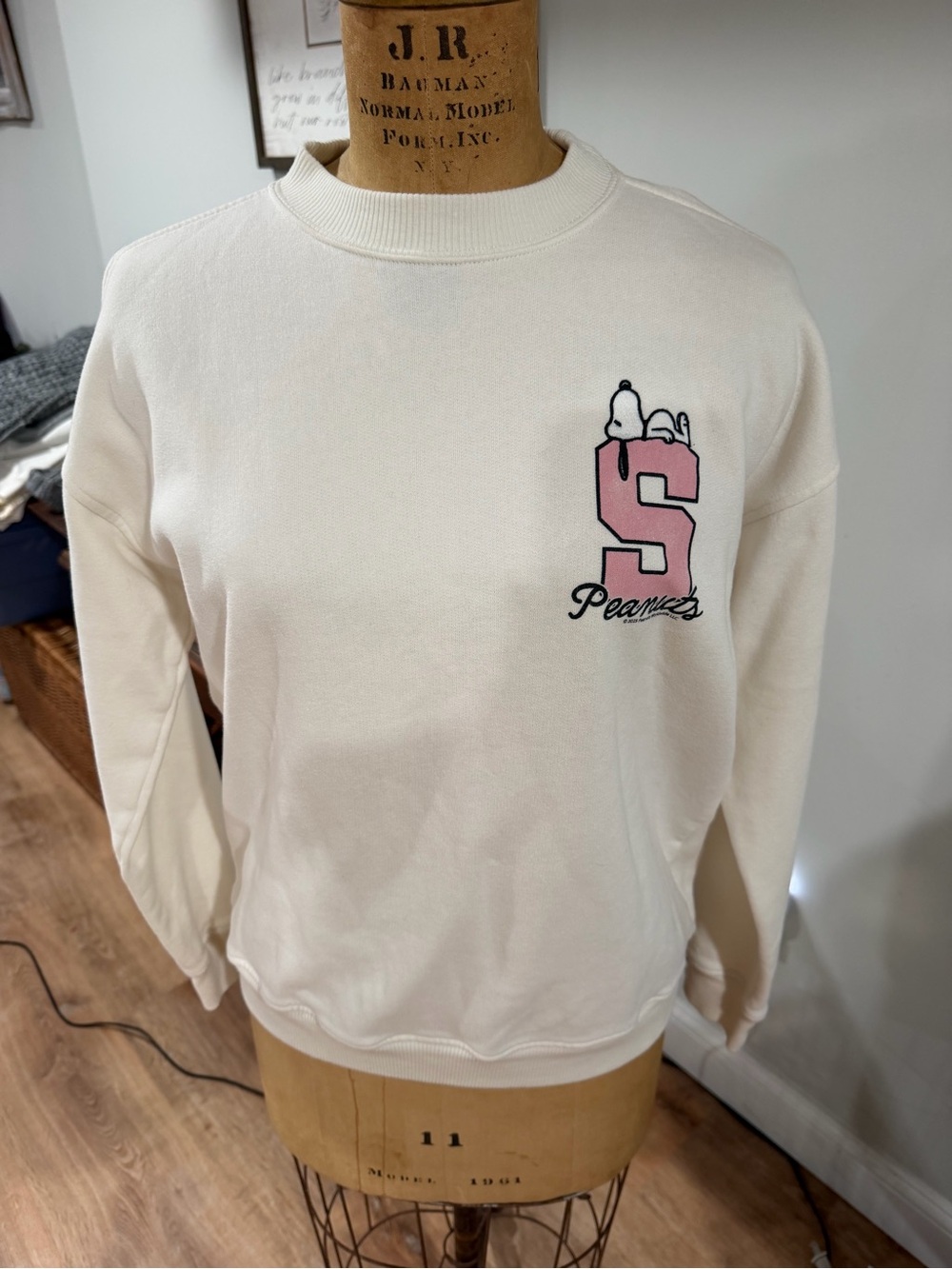 abercrombie kids Cream Crewneck with Pink 'S' Peanuts Graphic